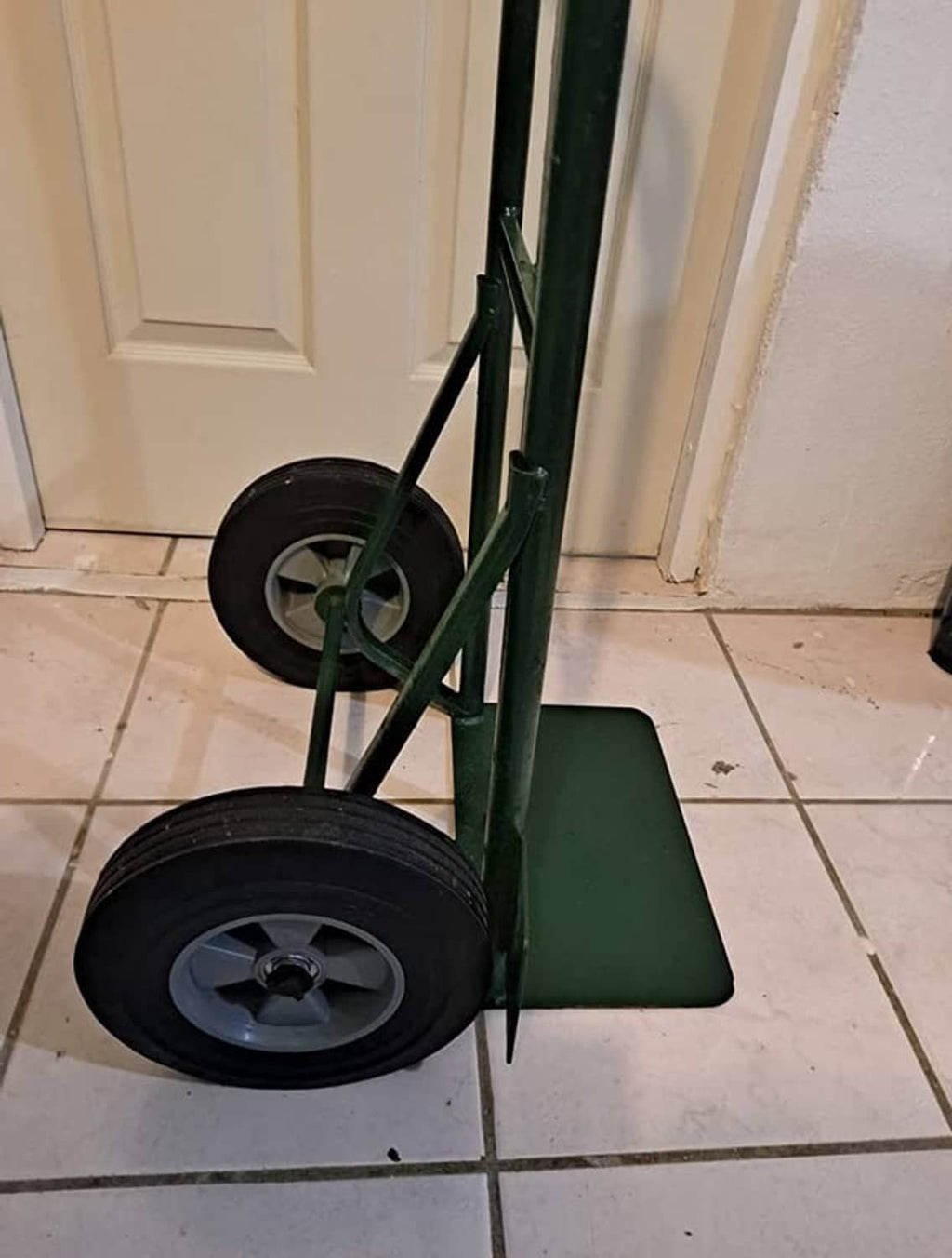 Hand truck wheels with solid rubber tires, black rims, metal center hubs