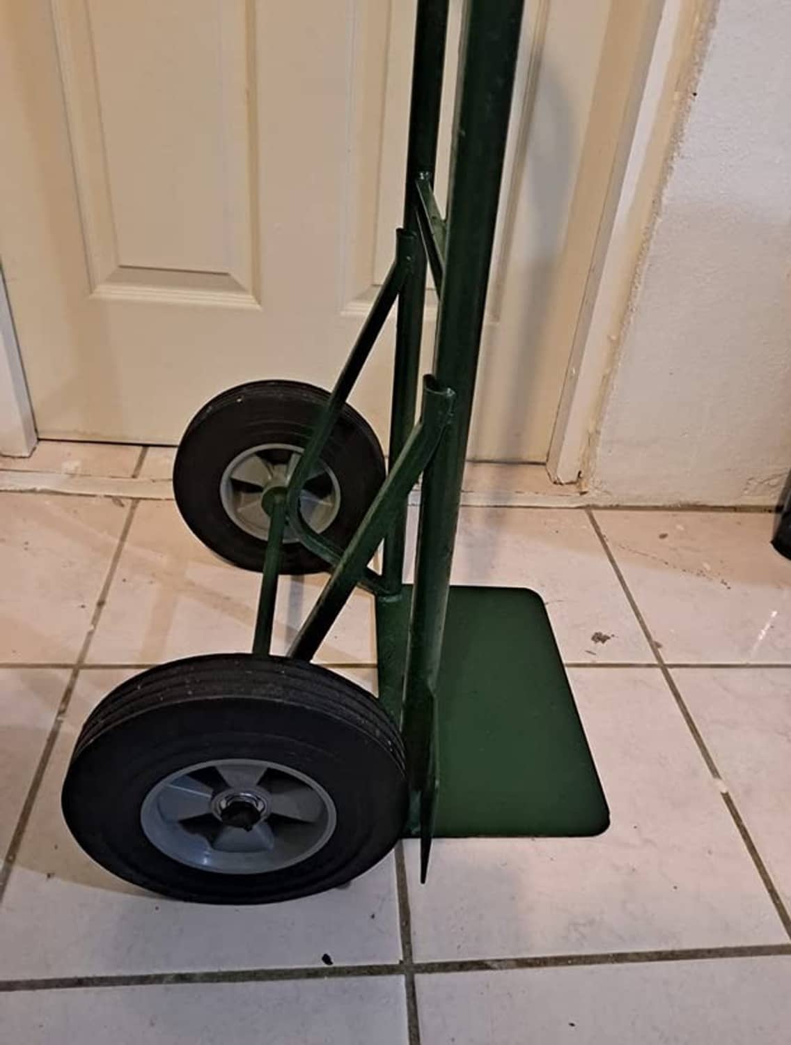 Hand truck wheels with solid rubber tires, black rims, metal center hubs