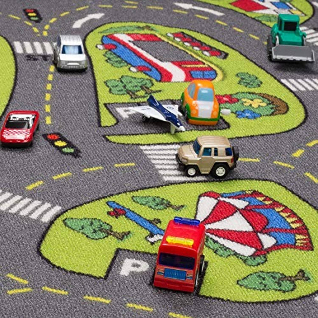 Kids city playmat rug close-up with toy vehicles on gray roads and green park areas