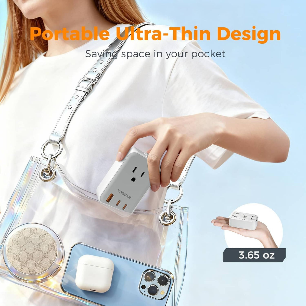Ultra-thin white travel adapter in hand with fold-out plug and charging ports