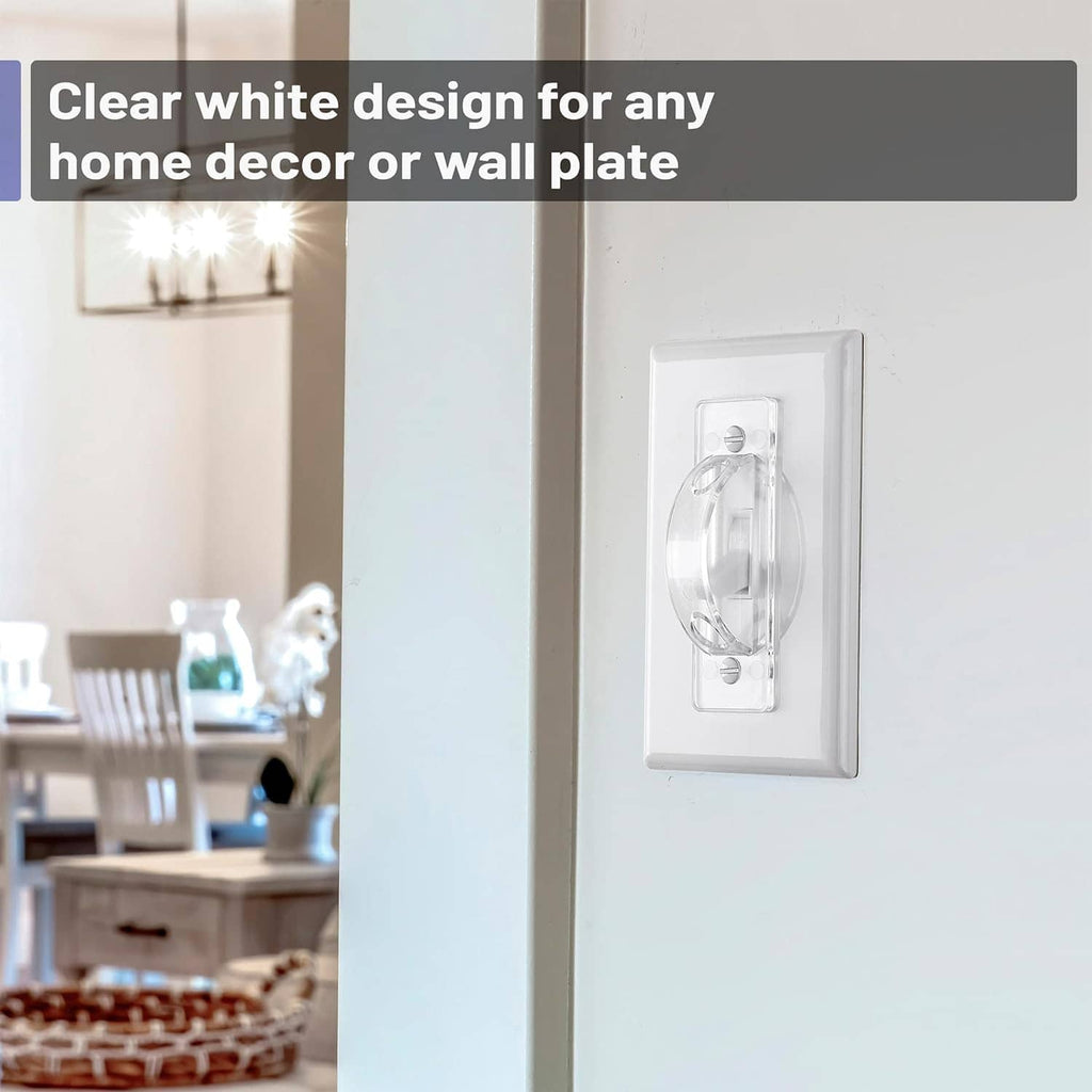 Clear toggle switch guard cover on a white wall plate, transparent protective cover