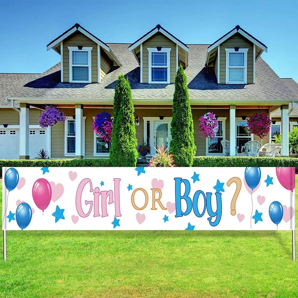 Gender reveal yard banner in front yard with “Girl or Boy” design, pink/blue balloons and stars