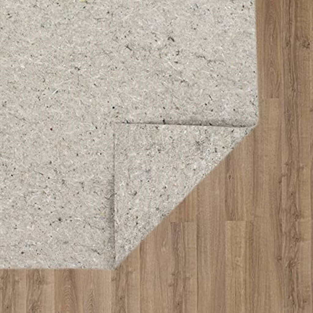 Light gray felt rug pad corner edge, protective cushioning on wood floor