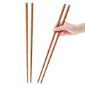 Beech wood chopsticks pair, straight brown wooden cooking utensils with smooth ends