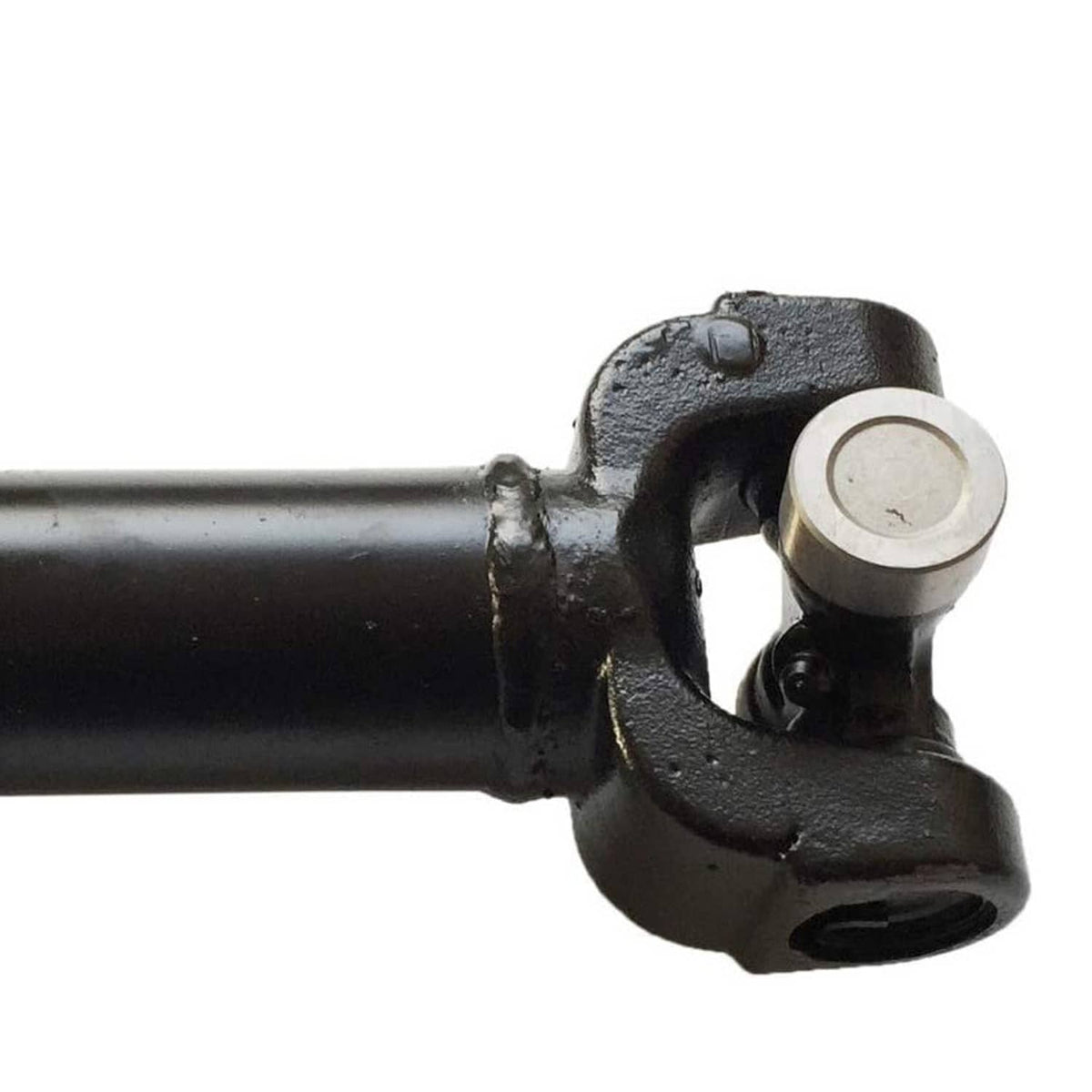 Front drive shaft universal-joint yoke end with black cast bracket and silver pin cap.