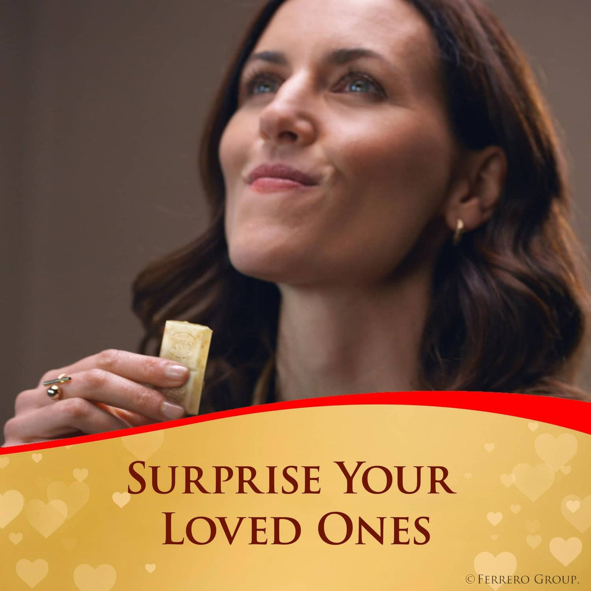 Ferrero Rocher white hazelnut chocolate bar in hand, ready to bite
