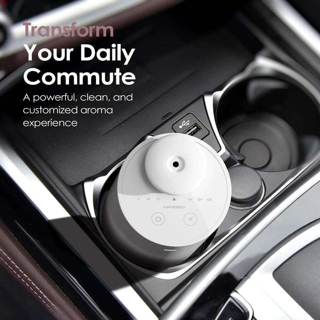 White waterless essential oil diffuser placed in a car cup holder