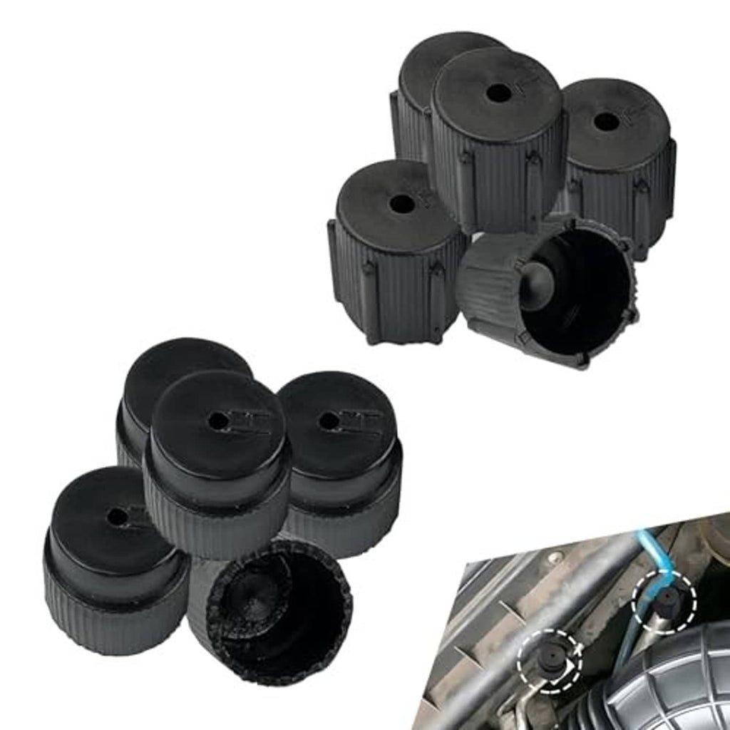 Multiple black A/C valve caps with ridged grip and open center for pressure lines