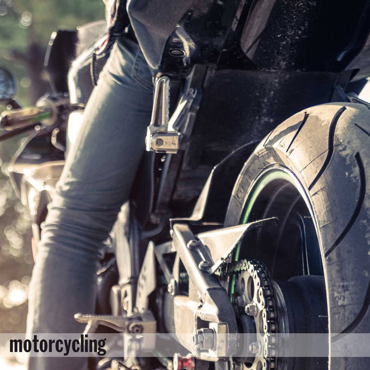 Motorcyclist in protective gear, promoting foam ear protection