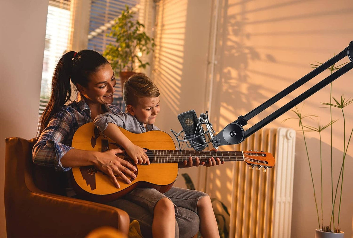 Microphone shock mount with studio microphone on boom arm in home recording