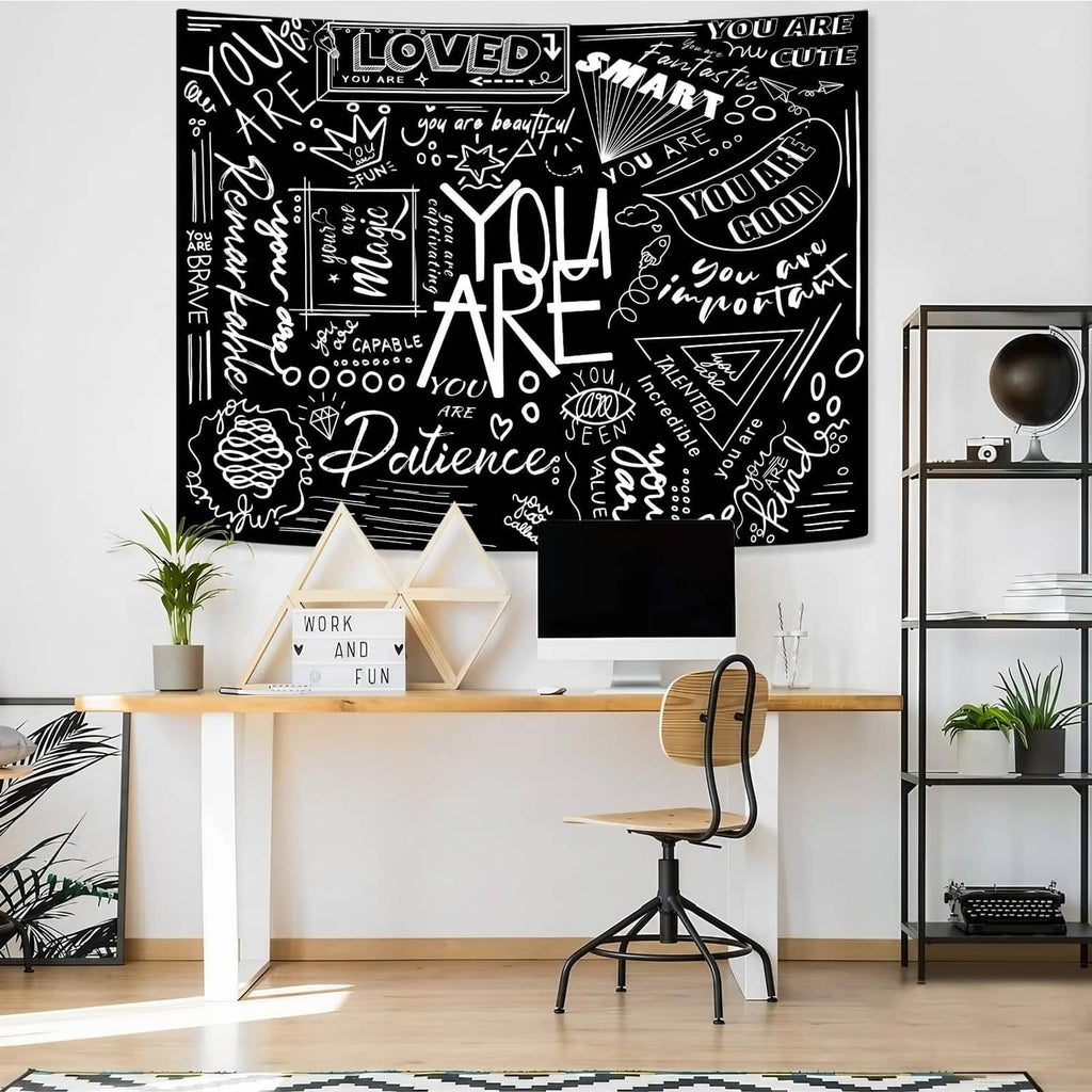 Black classroom tapestry with white lettering, doodles, and 'You Are Art' centerpiece