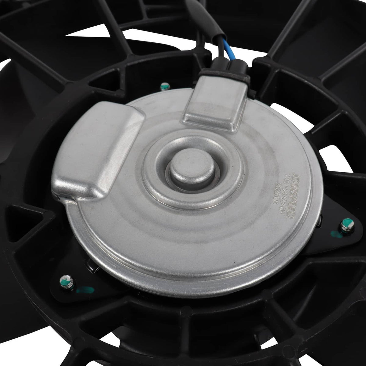 Radiator cooling fan motor cap and wiring area with metal and black housing details