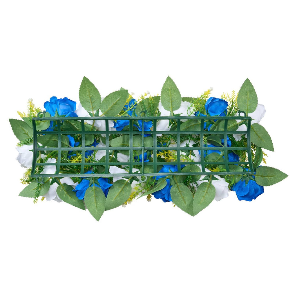 Fake floral centerpiece garland with blue rose heads, white flowers, green leaves on frame