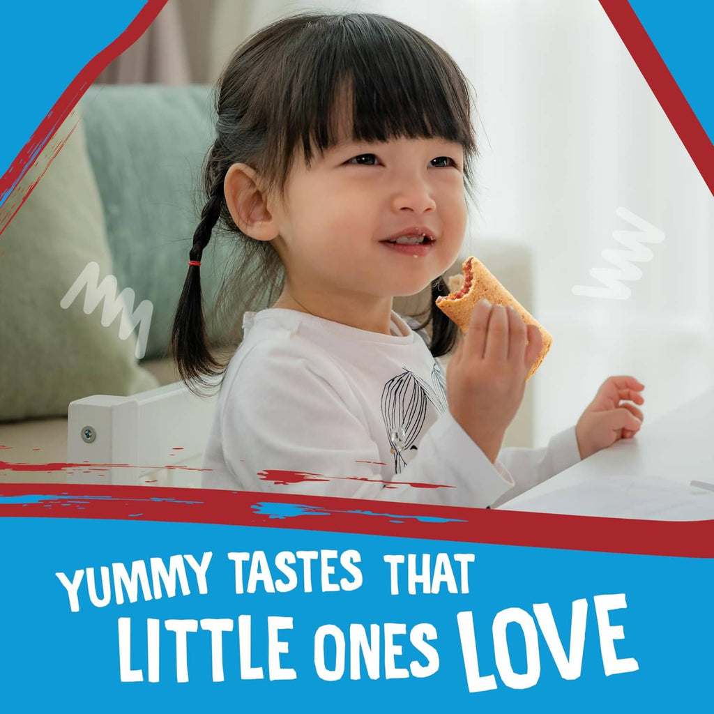 Child holding an apple-flavored snack bar, smiling in a seated indoor scene.