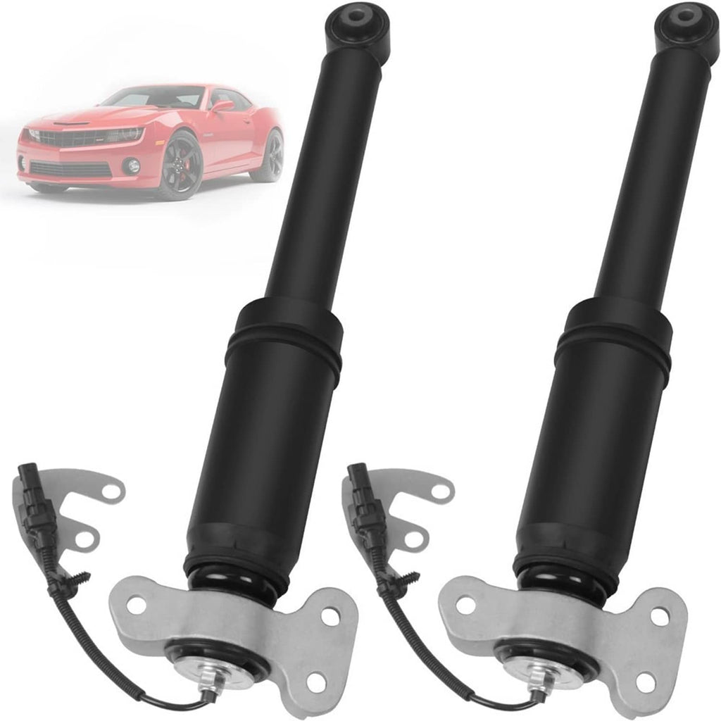 Two black rear shock absorber struts with metal top brackets and attached sensor cables