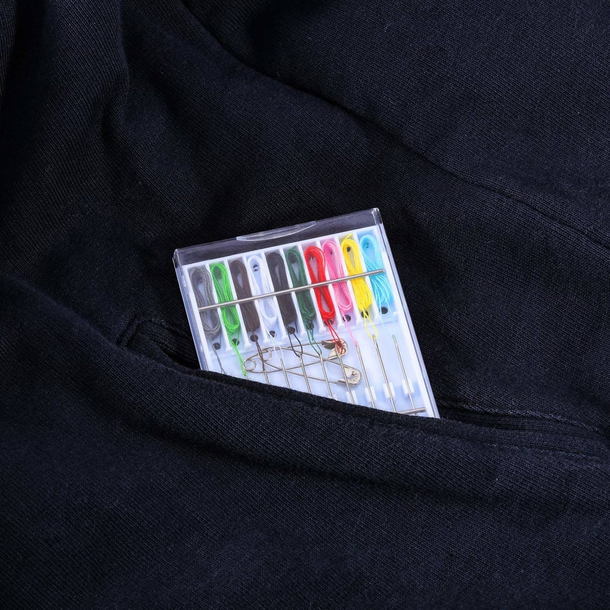 Pre-threaded hand sewing needle kit case with colorful threads on display
