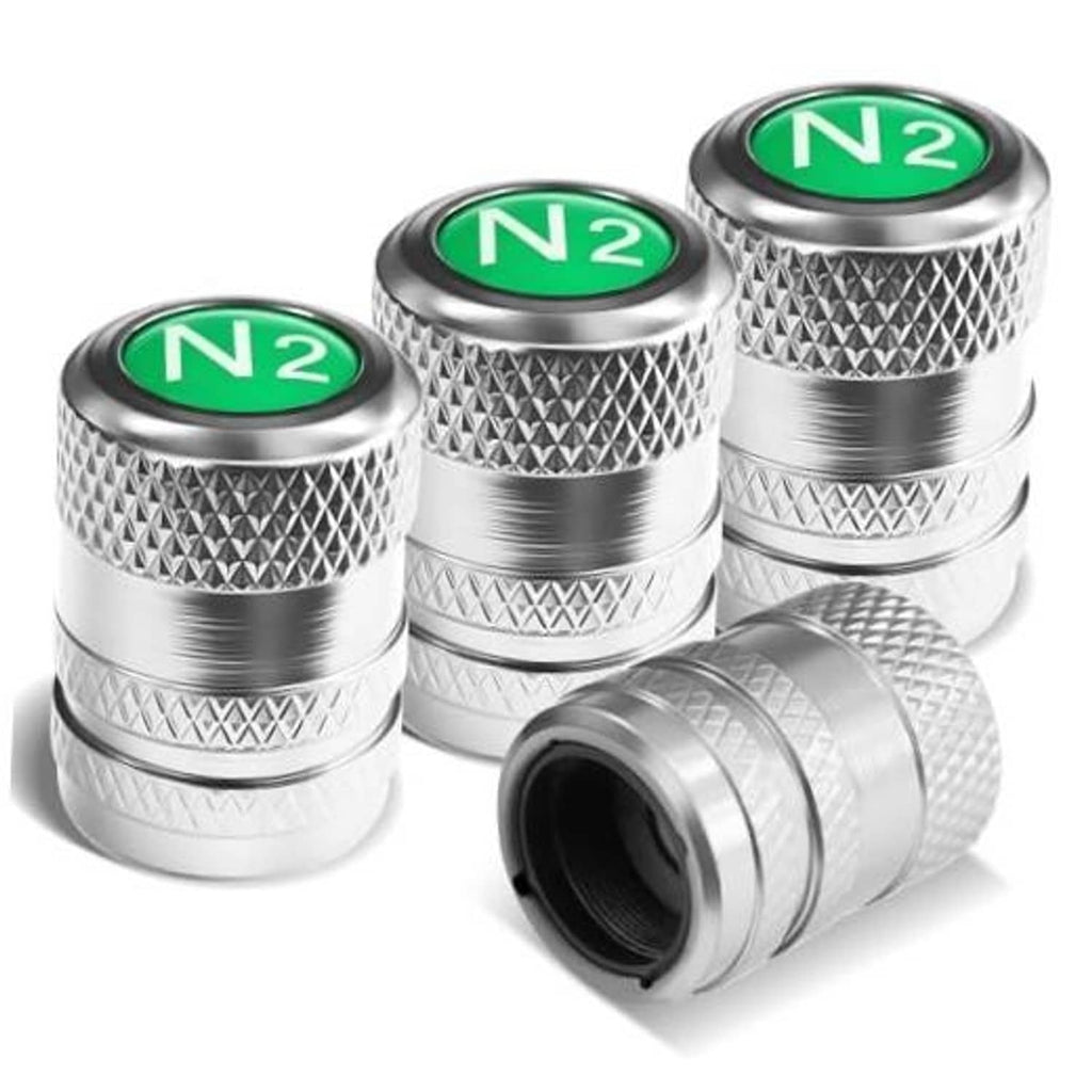 Silver tire valve stem caps with green N2 inserts and diamond-pattern grip (4-pack)