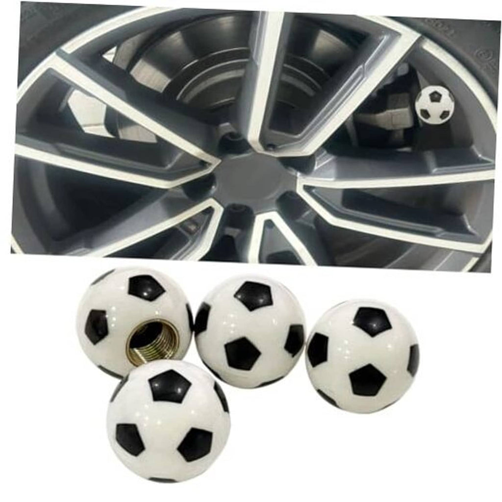 Car wheel with soccer ball valve cap plus four matching black-and-white tire valve covers shown.