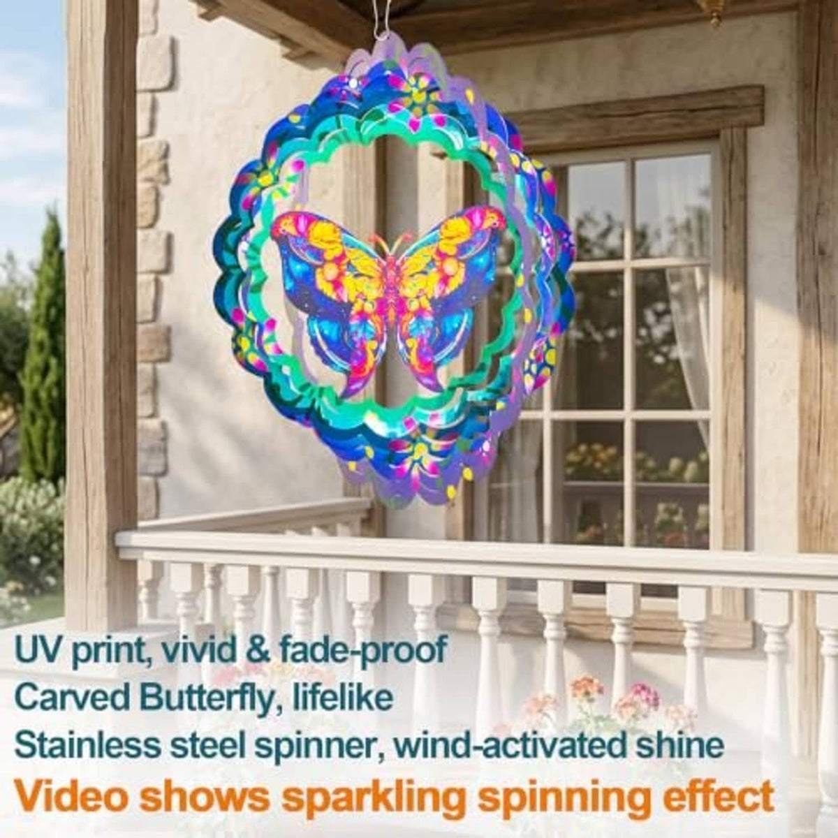 Hanging butterfly metal wind spinner with rainbow wings and scalloped blue-green frame