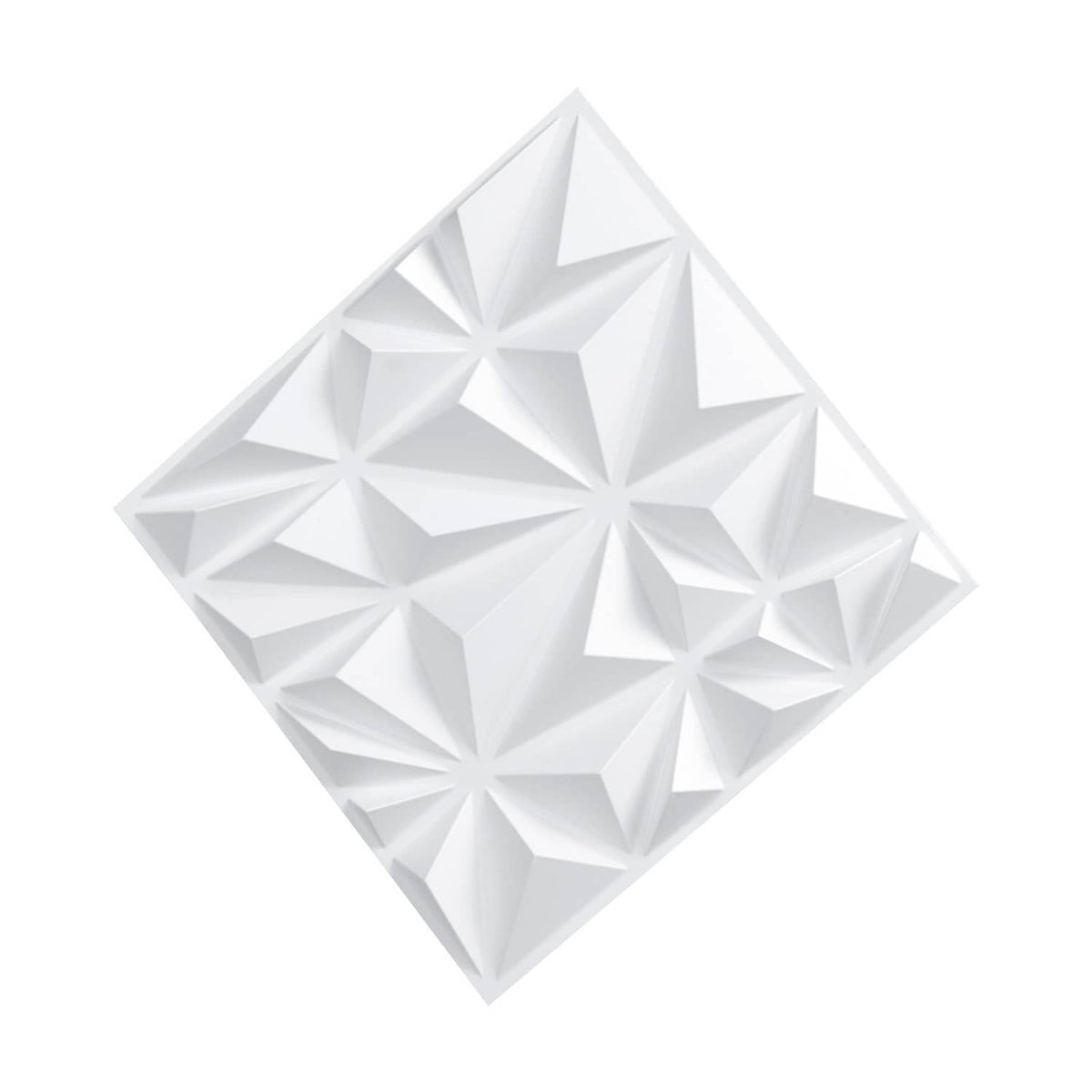 Close-up of white 3D diamond-relief wall panel tile with sharp geometric peaks