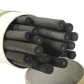 Charcoal sketching sticks, dark gray/black cylinder shapes in a bundle