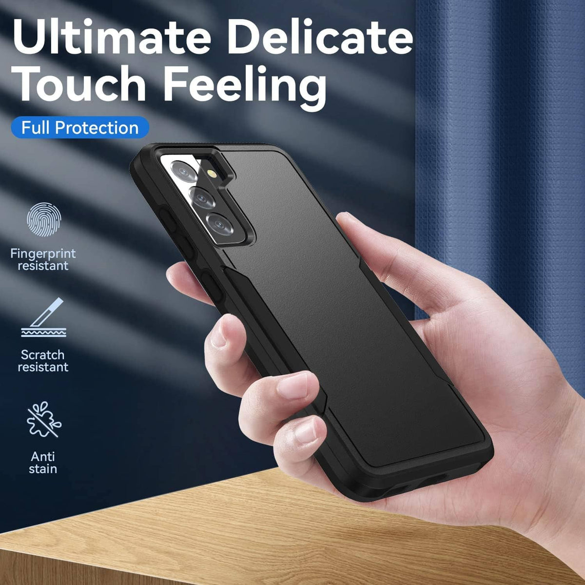 Rugged black phone case held in hand, with camera cutout and raised edges