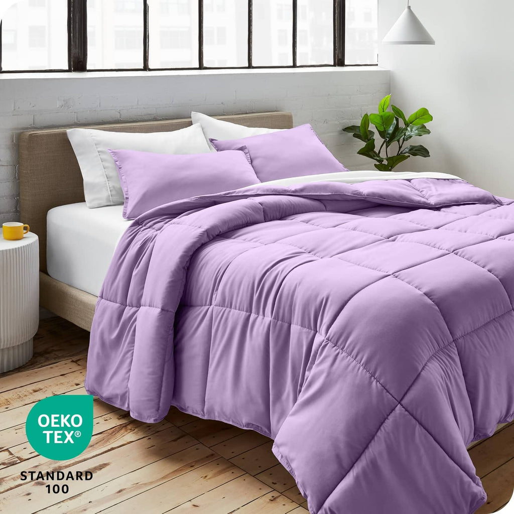 Lavender full comforter and pillow shams set, neatly draped on bed
