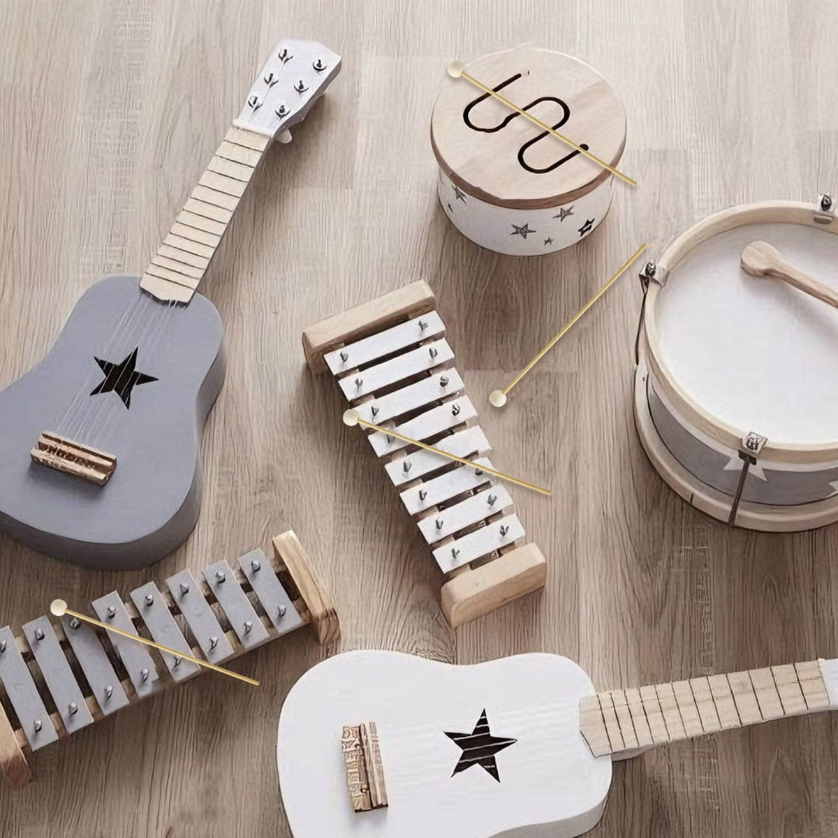 Wood percussion mallets with round white heads for a star-themed xylophone