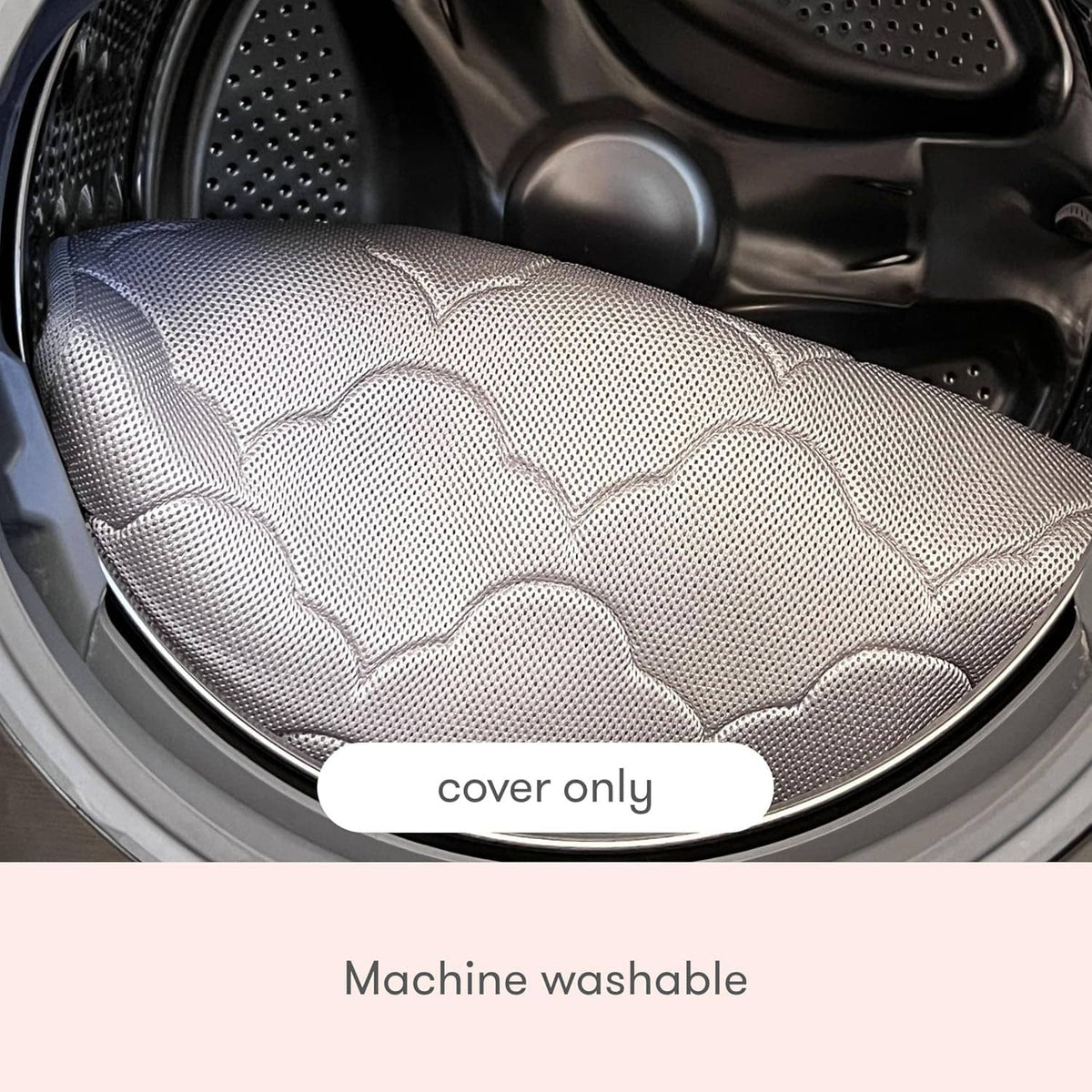 Grey mesh bassinet cover with quilted cloud pattern, shown in a washing machine