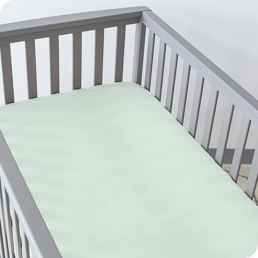 Mint green fitted crib sheet with smooth surface and tailored corner fit