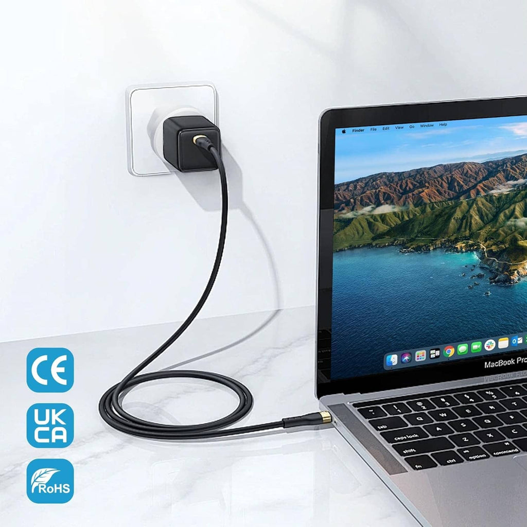 Type G UK plug adapter connected to a black cable for a laptop, white