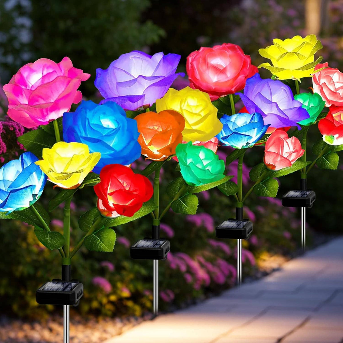 Cluster of solar rose garden lights with multicolor LED blooms on black stakes