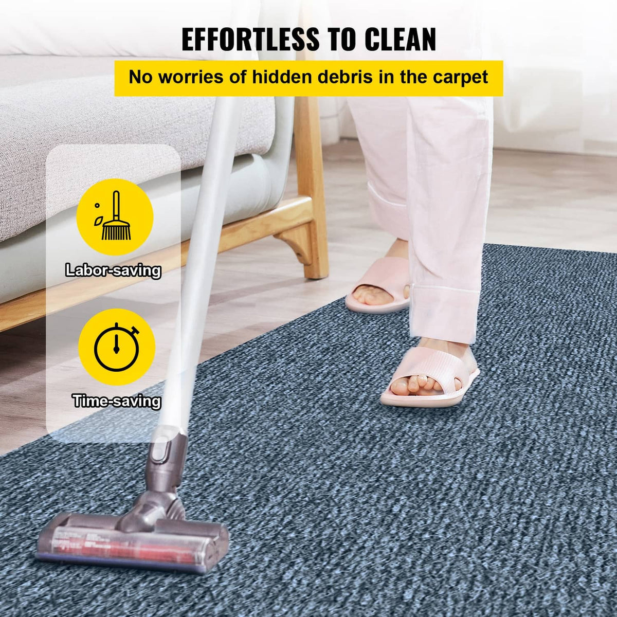Blue cut-pile rug on floor with vacuum cleaning brush, thick textured pile.