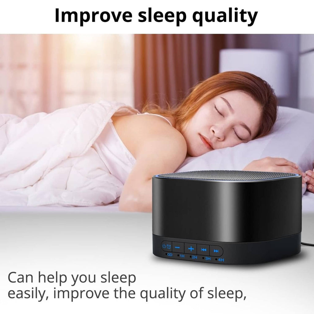 Black sound machine on bed with top speaker grille and blue control buttons