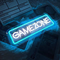 Rectangular neon sign reading GAME ZONE, ice blue and white glow