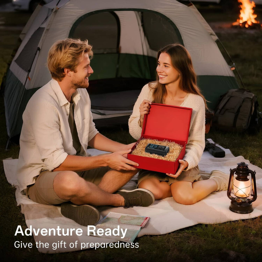 Portable air compressor accessory case open on blanket outdoors with included parts