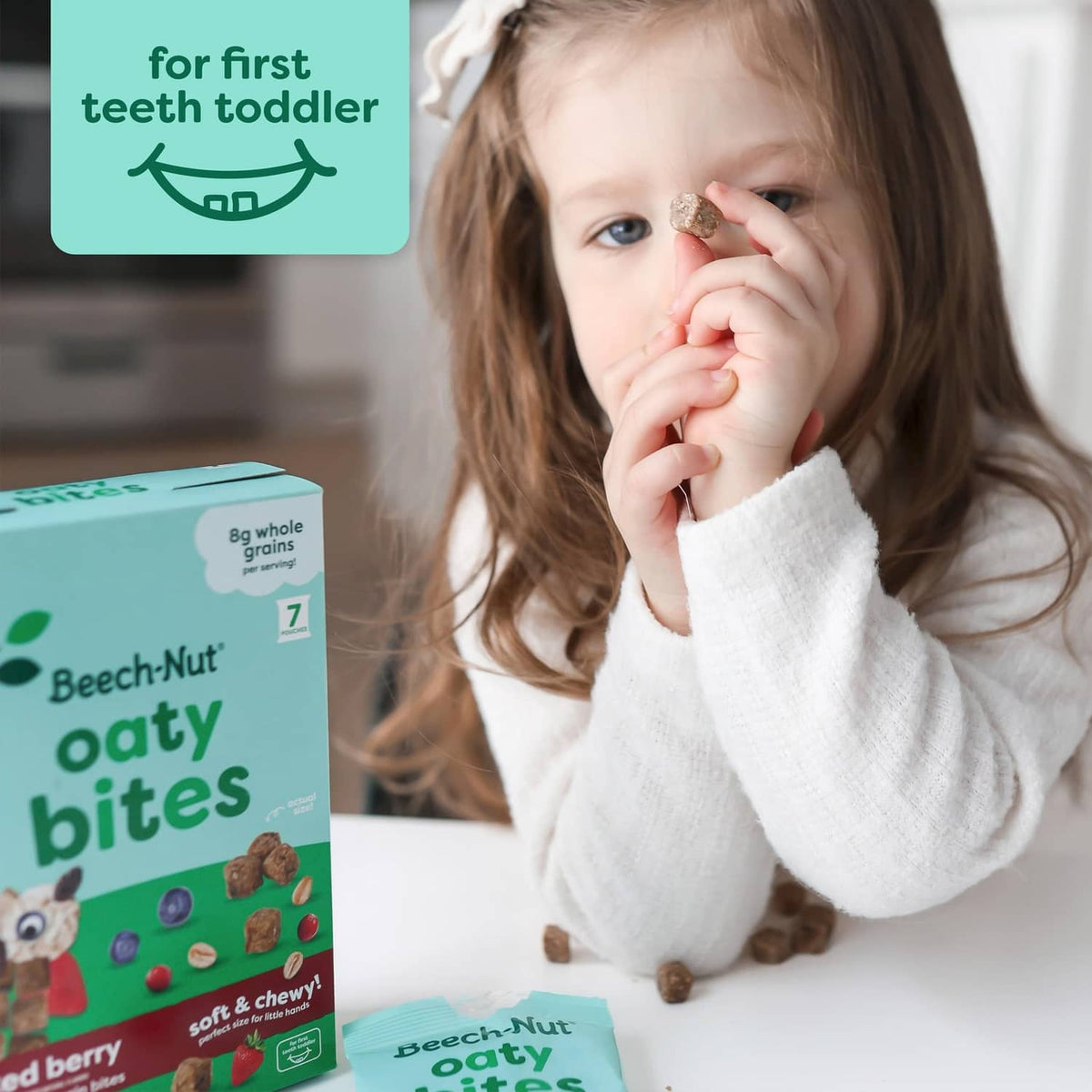Beech-Nut toddler snack pouch with berry flavor, beside a child eating.