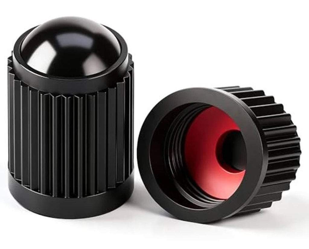 Two black ribbed valve stem caps with red O-ring inserts