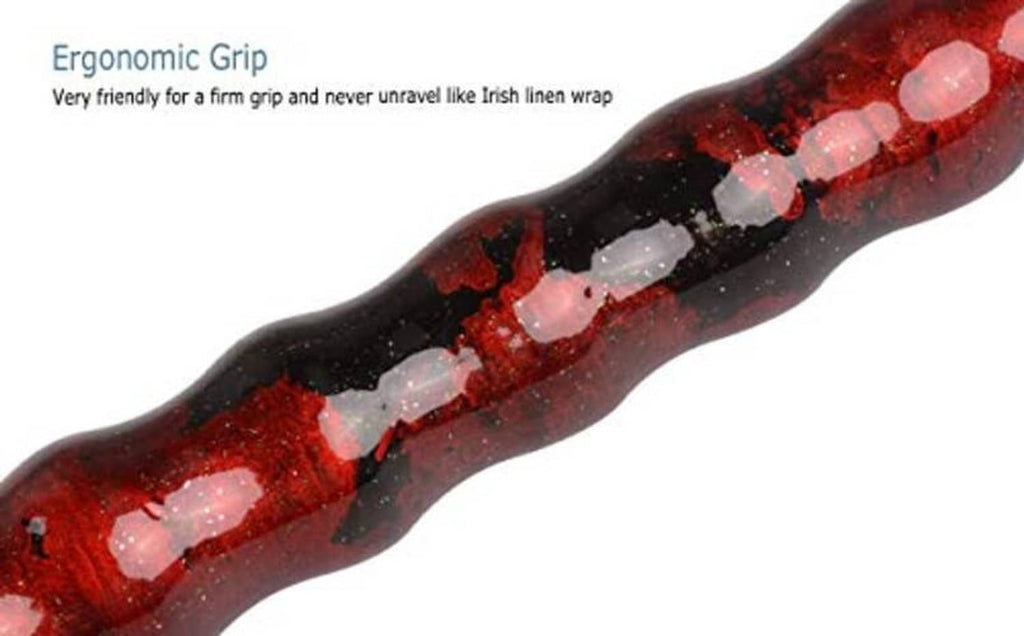 Ergonomic grip section on a red-and-black speckled pool cue with white dot pattern.