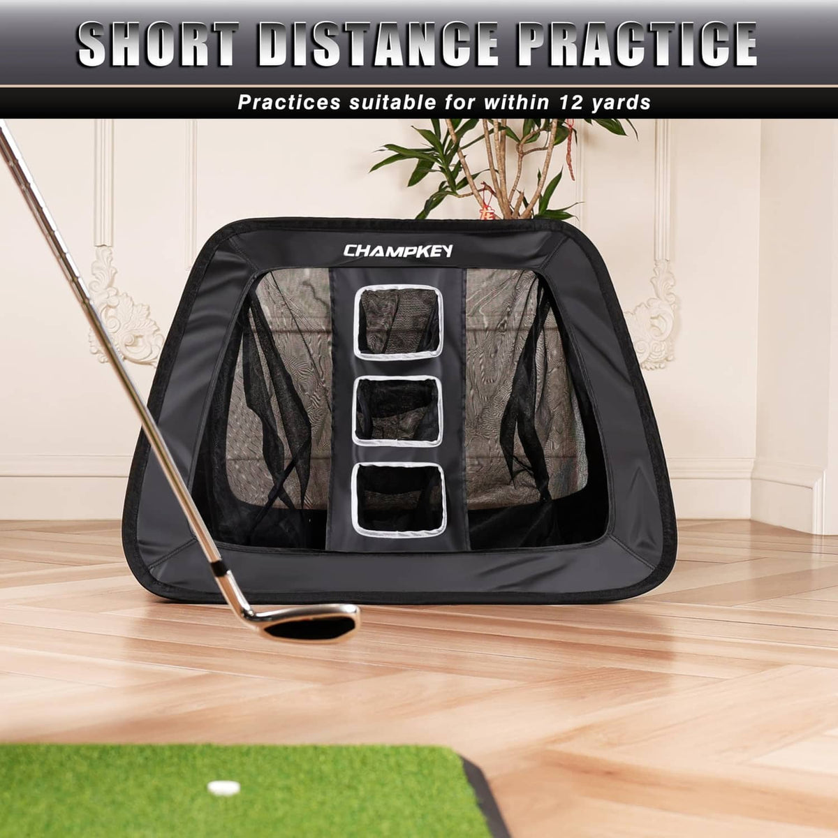 Black double-sided golf chipping net with attached practice mat and target windows