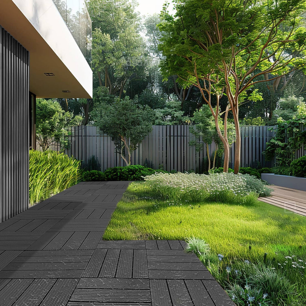 Dark grey interlocking deck tile pathway with square seams and low raised ribs