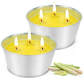 Pair of large citronella candles in silver tins with yellow wax and flames
