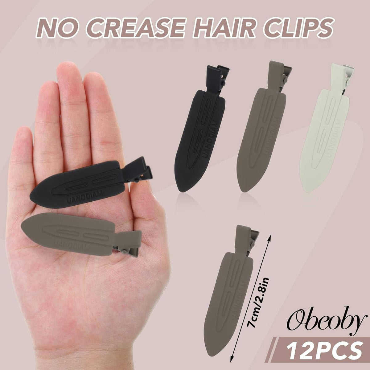 No-bend hair clips held in hand: black, gray, and white barrettes in a set