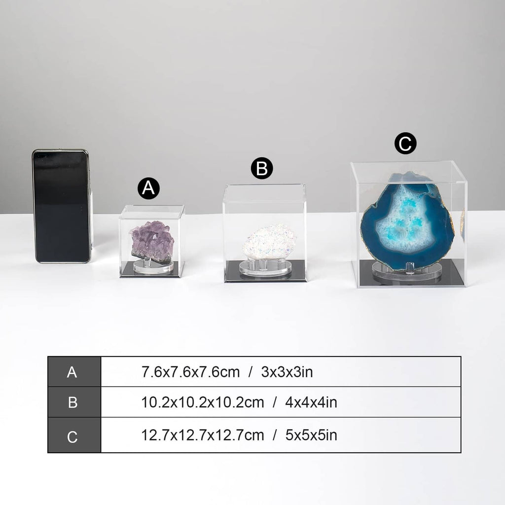 Clear acrylic display boxes in different sizes for a phone and crystals