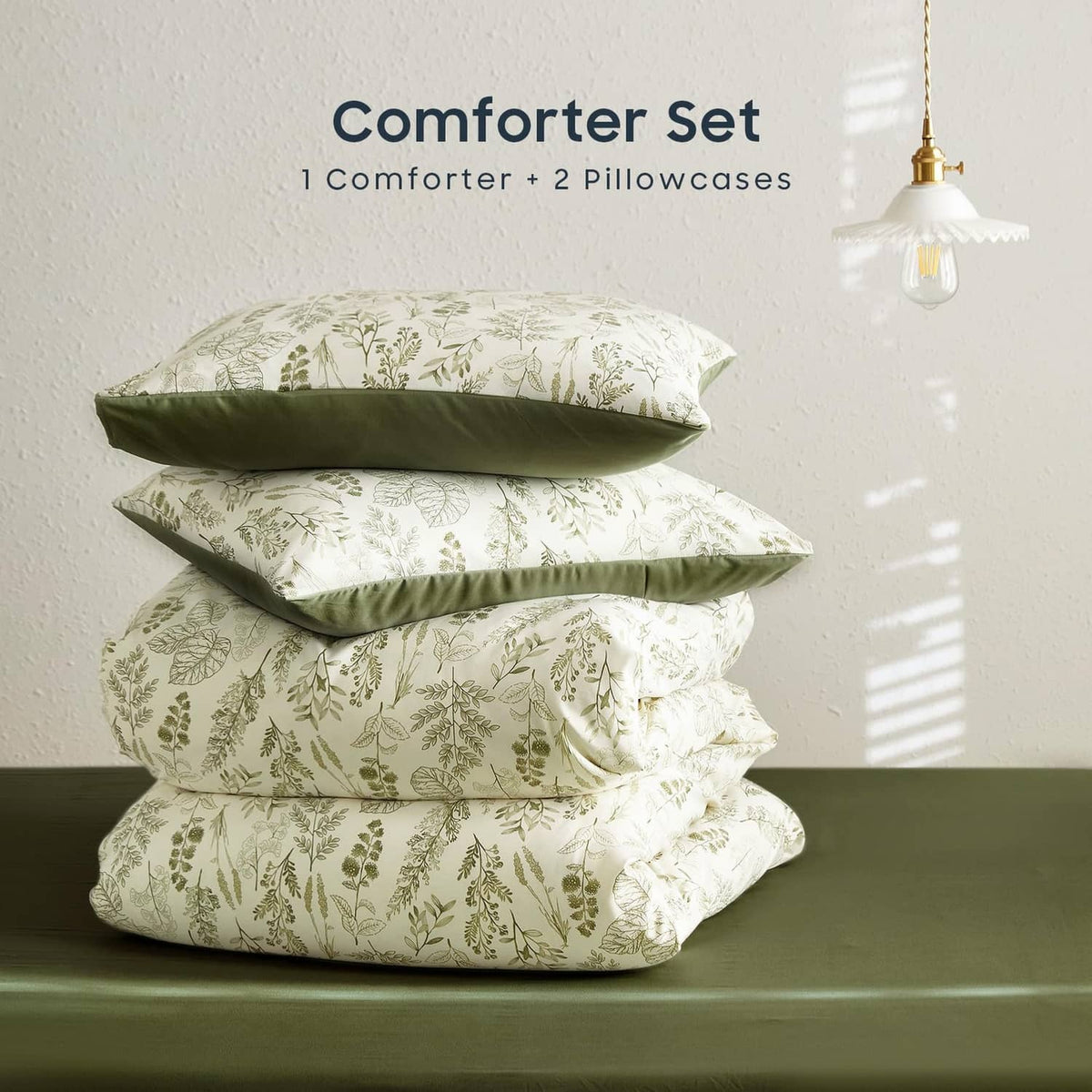 Stacked comforter set with green botanical leaf print and coordinating pillowcases