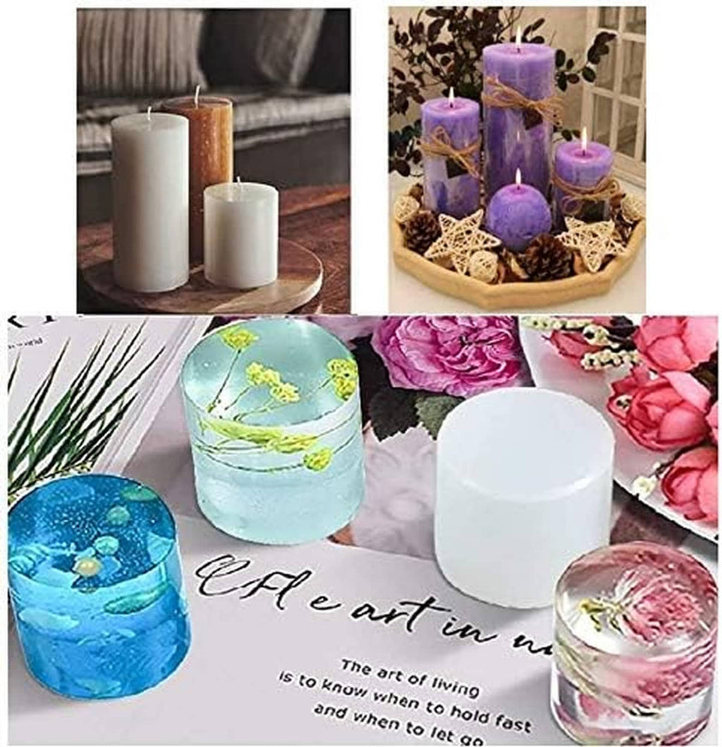 Multiple cylindrical candle molds filled with decorative pillar candles in assorted colors.