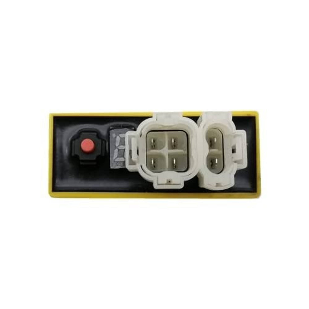 Racing CDI ignition module base with visible pin connectors and small red button