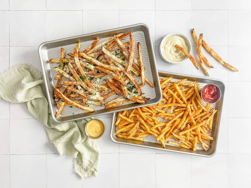 Quarter sheet baking pan with roasted fries and shrimp
