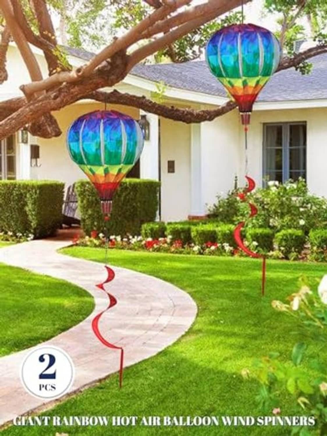 Two rainbow hot air balloon wind spinners with multicolor canopies and spiral tails
