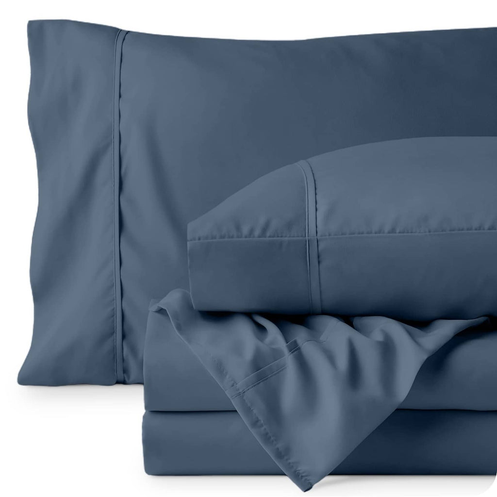 Blue twin pillowcases and fitted sheet detail, soft matte fabric with stitched edges